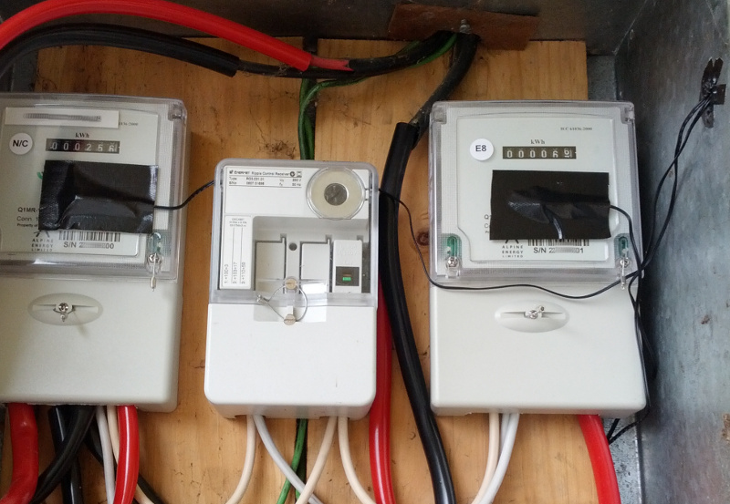 Electricity meter box with Arduino light sensors counting impulse flashes then broadcasting over MQTT